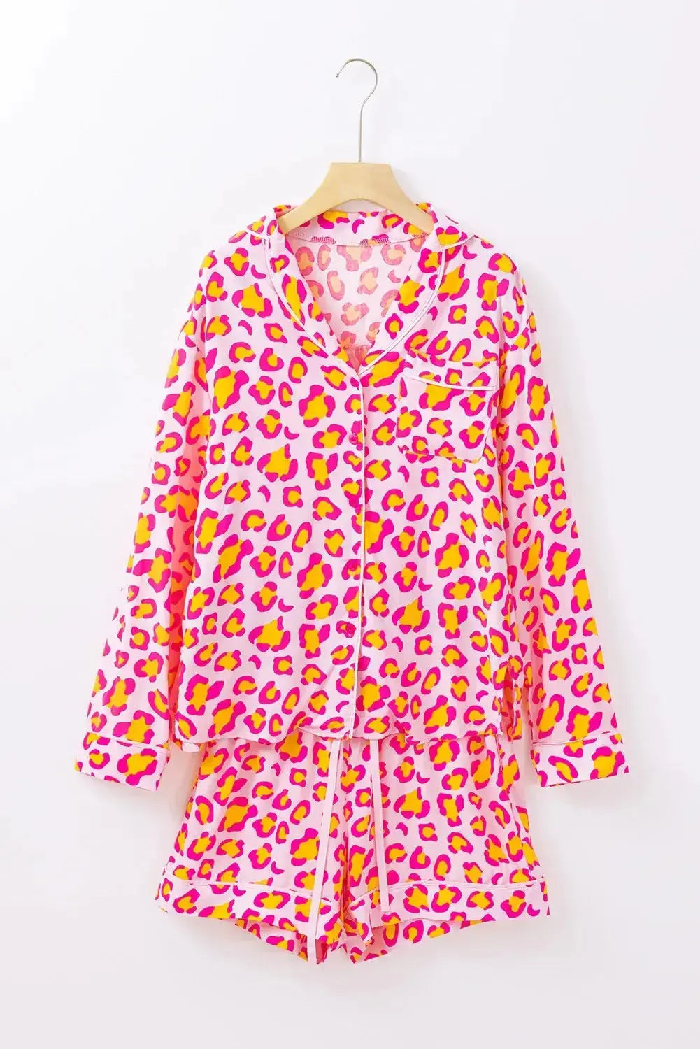 Women’s leopard print long sleeve collared lounge top and shorts set by Trendsi, comfortable pajama sleepwear with stylish pattern.