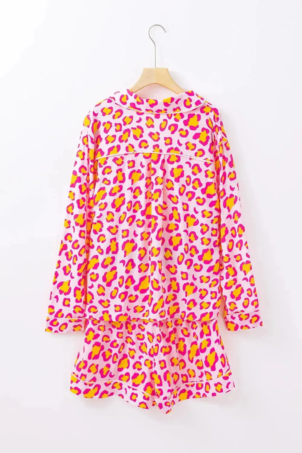 Women's leopard print long sleeve pajama top and shorts lounge set by Trendsi, featuring a collared design and comfortable fit.