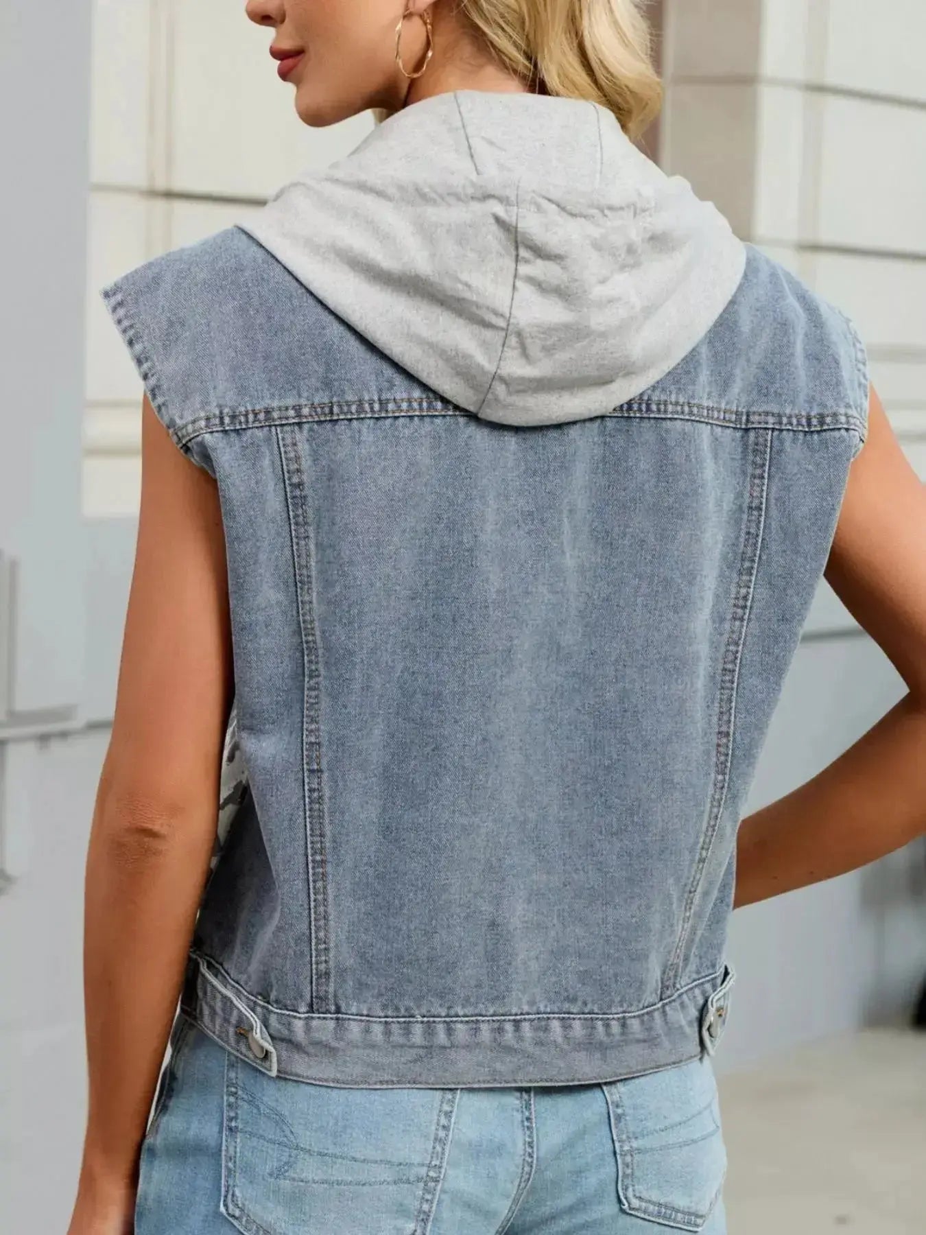 Women's leopard print hooded denim vest by Trendsi, sleeveless button-down jean jacket with leopard pattern and casual fit.