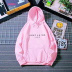 Women’s oversized graphic letter print hoodie by Plush Fashion Hub, cozy streetwear style with a relaxed fit and bold print design.