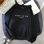 Women wearing a plush fashion hub oversized graphic letter print hoodie, cozy streetwear style, in a casual urban setting.