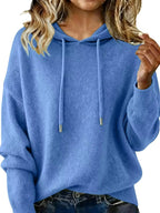 Women's long sleeve hooded sweater with drawstring, cozy casual pullover by Trendsi, featuring a relaxed fit and comfortable fabric.