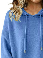 Women’s long sleeve drawstring hooded sweater by Trendsi, cozy casual pullover with a relaxed fit and stylish hood detail.