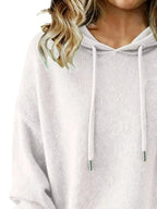 Women’s long sleeve drawstring hooded sweater by Trendsi, cozy casual pullover in soft fabric with a relaxed fit.