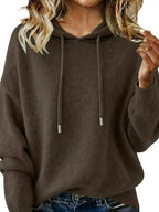 Women’s long sleeve drawstring hooded sweater by Trendsi, cozy casual pullover with a relaxed fit and front pocket.