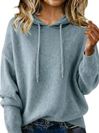 Women's long sleeve hooded sweater with drawstring, cozy casual pullover from Trendsi, perfect for comfortable everyday wear.