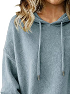 Women's long sleeve drawstring hooded sweater by Trendsi, cozy casual pullover with a relaxed fit and comfortable fabric.