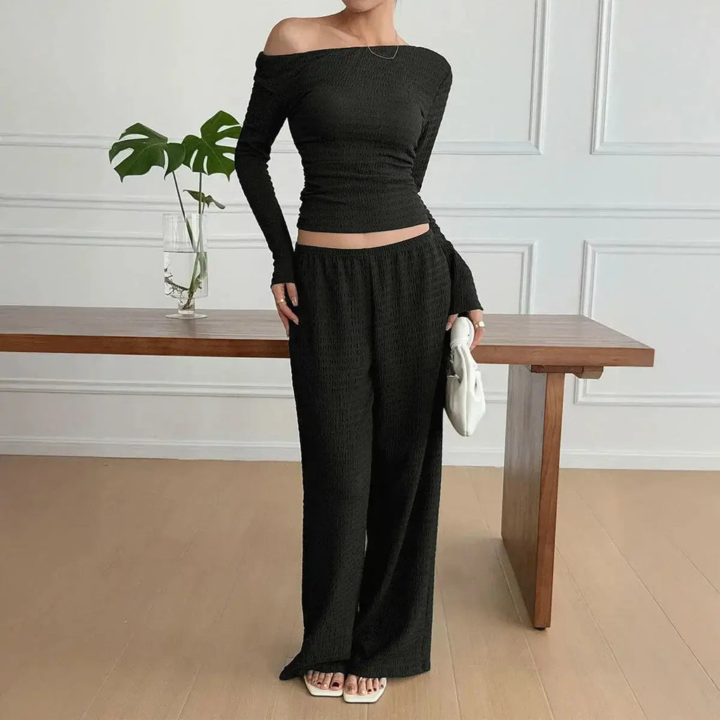 Women wearing Plush Fashion Hub long sleeve knit two-piece lounge set, featuring a cozy top and matching pants in a relaxed fit.