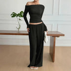 Women wearing Plush Fashion Hub long sleeve knit two-piece lounge set, featuring a cozy top and matching pants in a relaxed fit.