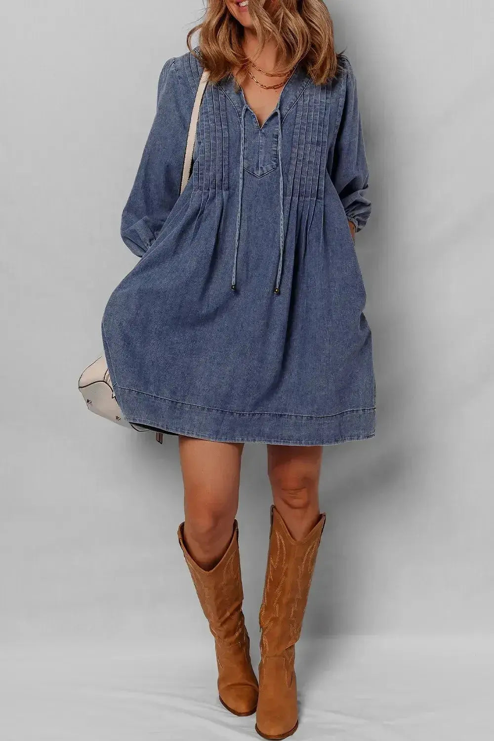 Women’s long sleeve tie neck denim mini dress by Plush Fashion Hub, made of soft cotton in casual style with a trendy design.