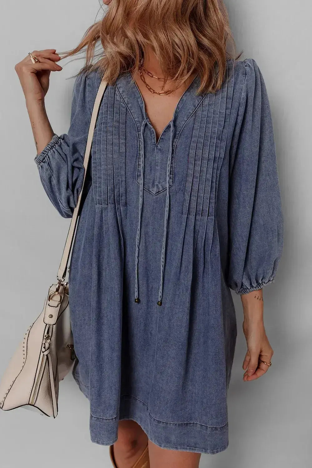 Women's long sleeve denim mini dress with tie neck, soft cotton fabric, casual style, by Trendsi.