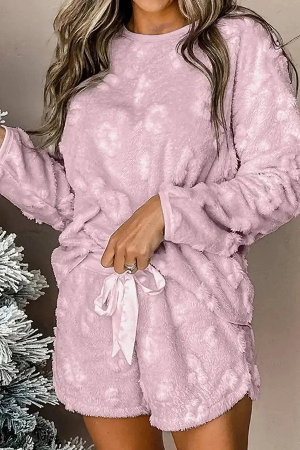 Women’s long sleeve top and drawstring shorts loungewear set featuring comfortable fabric and relaxed fit, perfect for cozy evenings.