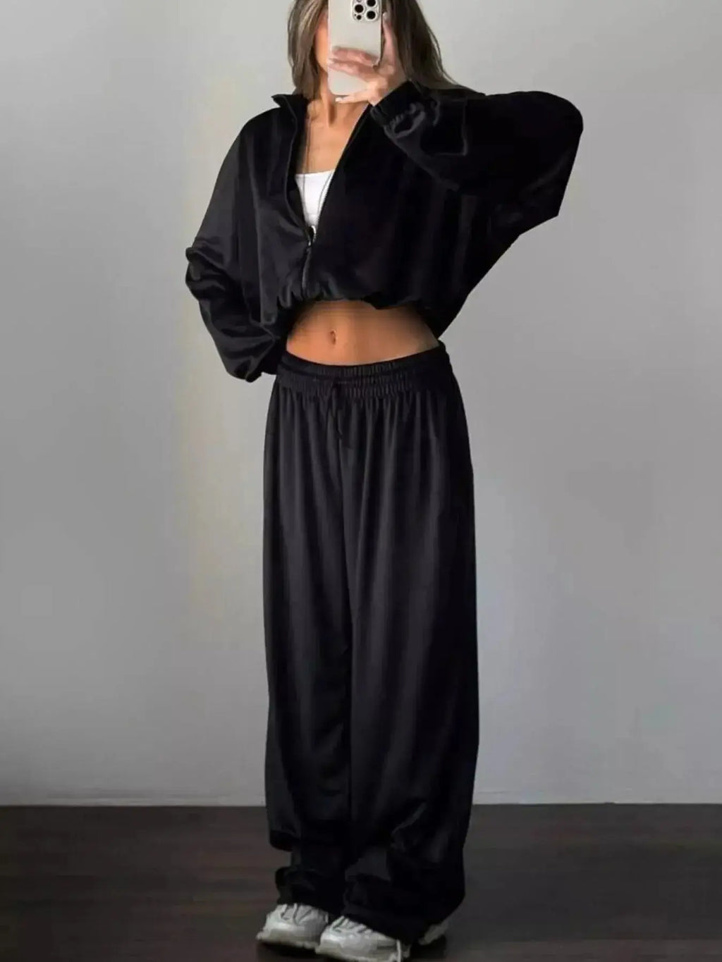 Women’s plush long sleeve zip-up jacket and matching pants lounge set by Trendsi, cozy and stylish for relaxed wear.
