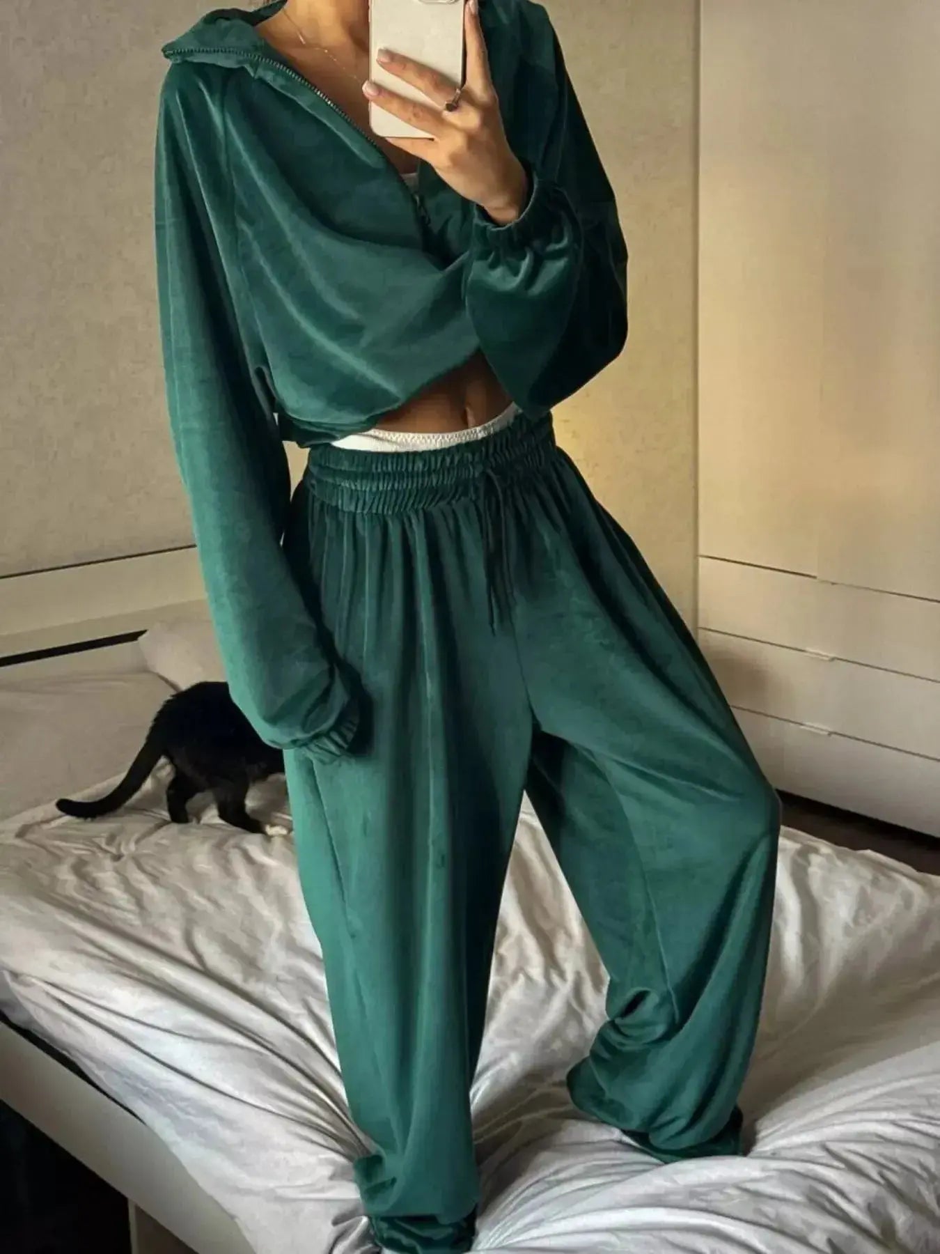 Women’s plush long sleeve zip-up jacket and pants lounge set by Trendsi, cozy and stylish for relaxing or casual wear.