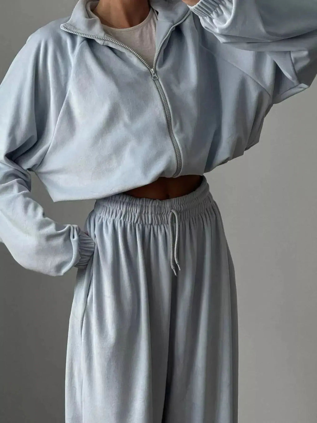 Women’s long sleeve zip-up jacket and pants lounge set by Trendsi, plush fabric, casual comfortable sleepwear or loungewear.