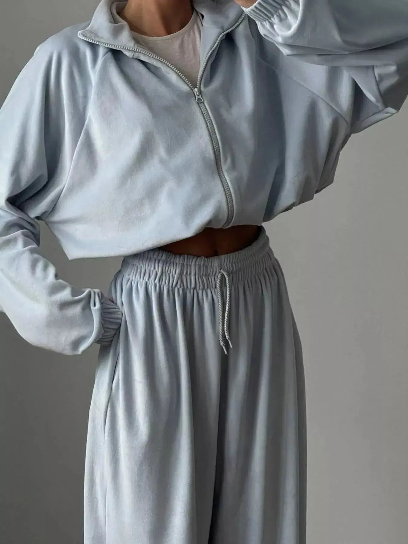Women’s long sleeve zip-up jacket and pants lounge set by Trendsi, plush fabric, casual comfortable sleepwear or loungewear.