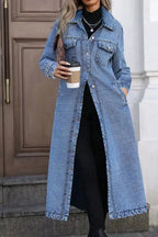Women’s longline oversized denim jacket with button-down front and utility style, made of cotton, by Trendsi.