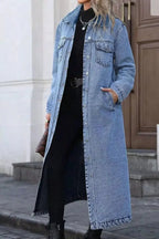 Women’s longline denim jacket with button-down front, oversized fit, cotton fabric, and utility style for casual wear.
