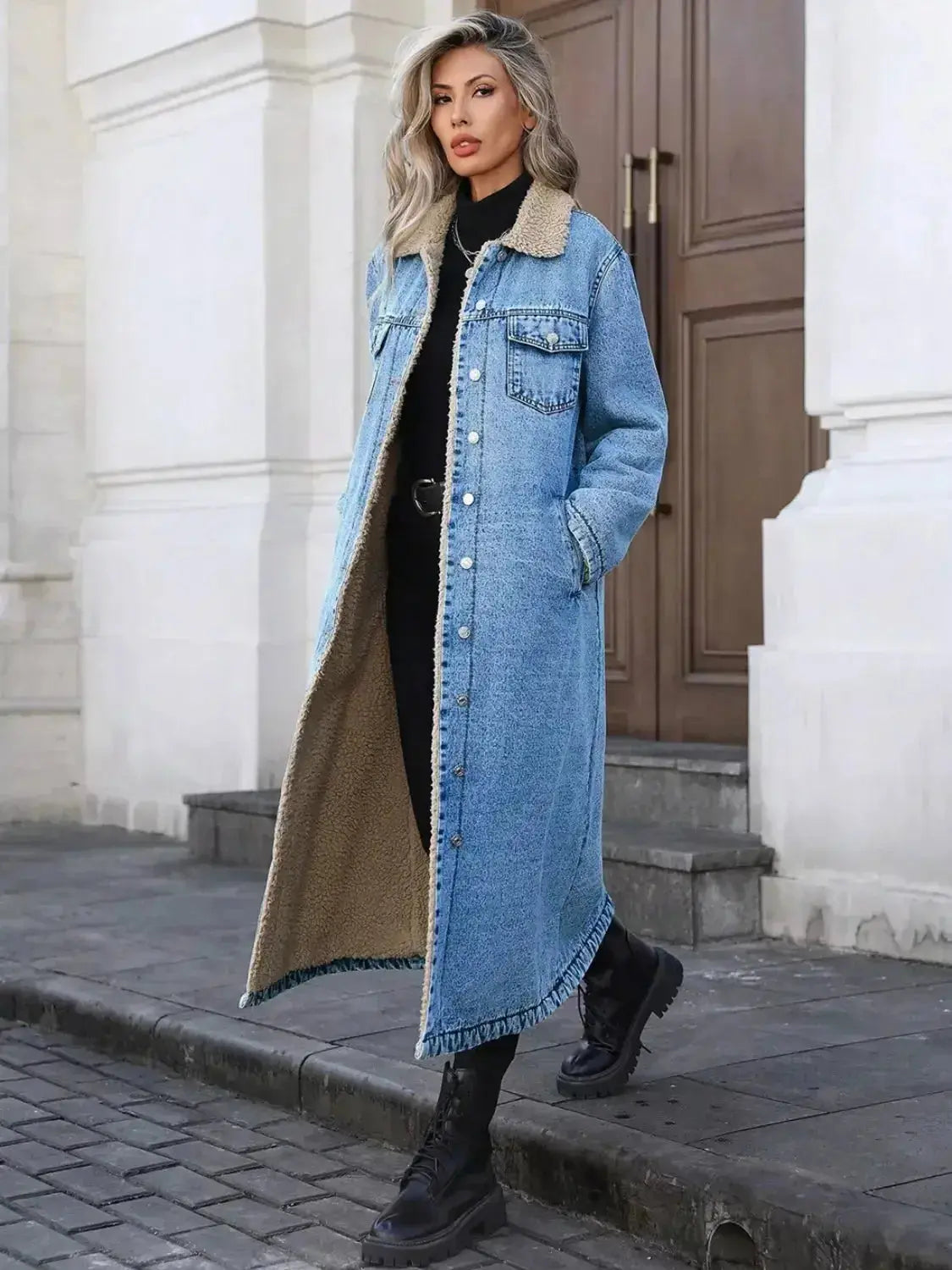 Women’s longline denim jacket with sherpa lining by Trendsi, cozy fall and winter outerwear, featuring classic denim style and warm interior.