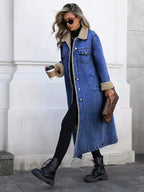 Women's longline denim jacket with sherpa lining, cozy fall and winter outerwear by Trendsi, showcasing the stylish denim exterior.