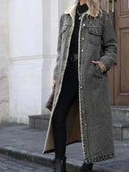Women’s longline denim jacket with sherpa lining, cozy fall and winter outerwear by Trendsi, featuring classic denim style and warm interior.
