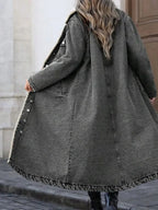 Women’s longline denim jacket with cozy sherpa lining, perfect for fall and winter outerwear, by Trendsi.