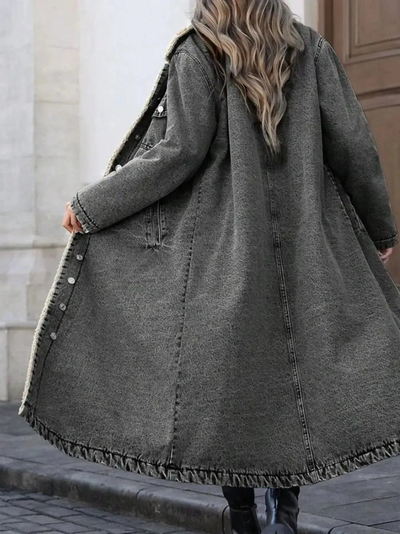 Women’s longline denim jacket with cozy sherpa lining, perfect for fall and winter outerwear, by Trendsi.