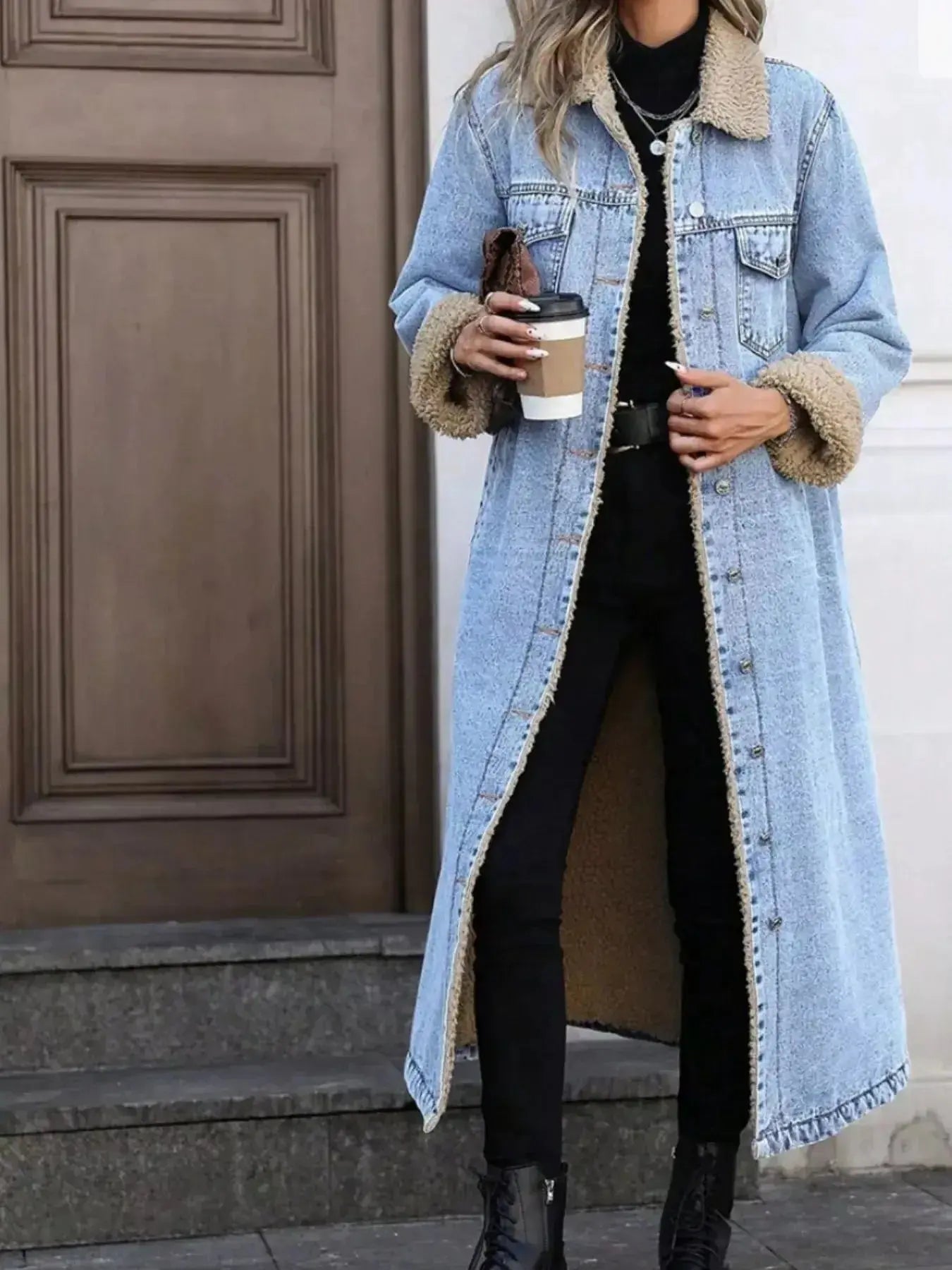 Women's longline denim jacket with cozy sherpa lining, stylish fall and winter outerwear by Trendsi