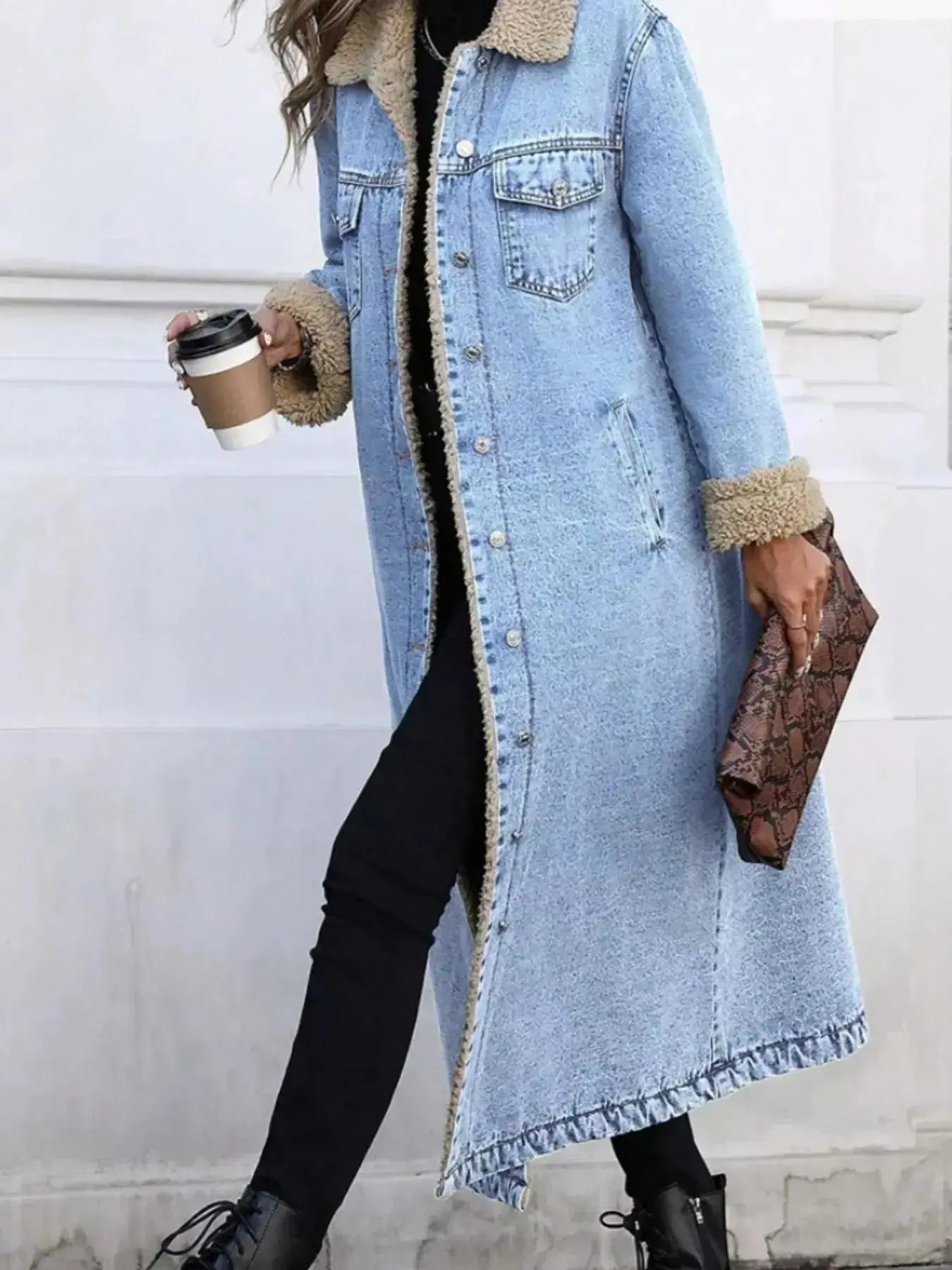 Women’s longline denim jacket with plush Sherpa lining, cozy fall and winter outerwear from Trendsi.