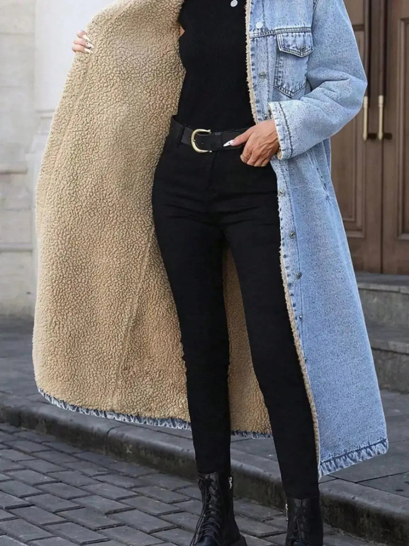Women’s longline denim jacket with sherpa lining, cozy fall and winter outerwear by Trendsi, featuring classic denim style and warm interior.