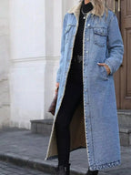 Women's longline denim jacket with cozy sherpa lining, perfect for fall and winter outerwear by Trendsi.