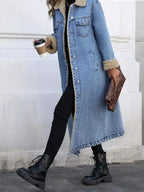 Women's longline denim jacket with cozy sherpa lining, perfect for fall and winter outerwear by Trendsi.