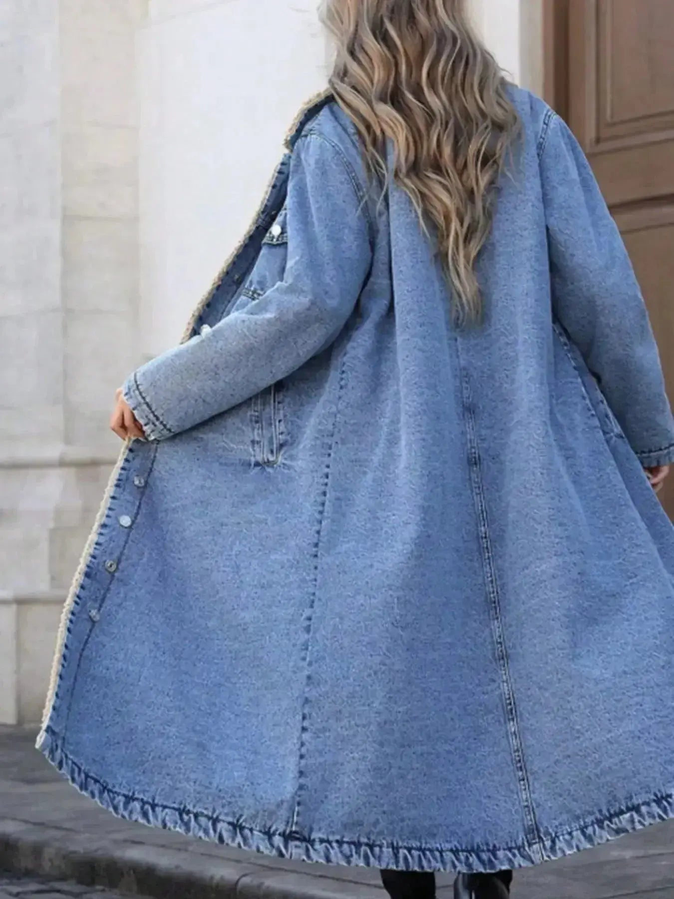 Women's longline denim jacket with cozy sherpa lining, perfect for fall and winter, stylish outerwear by Trendsi