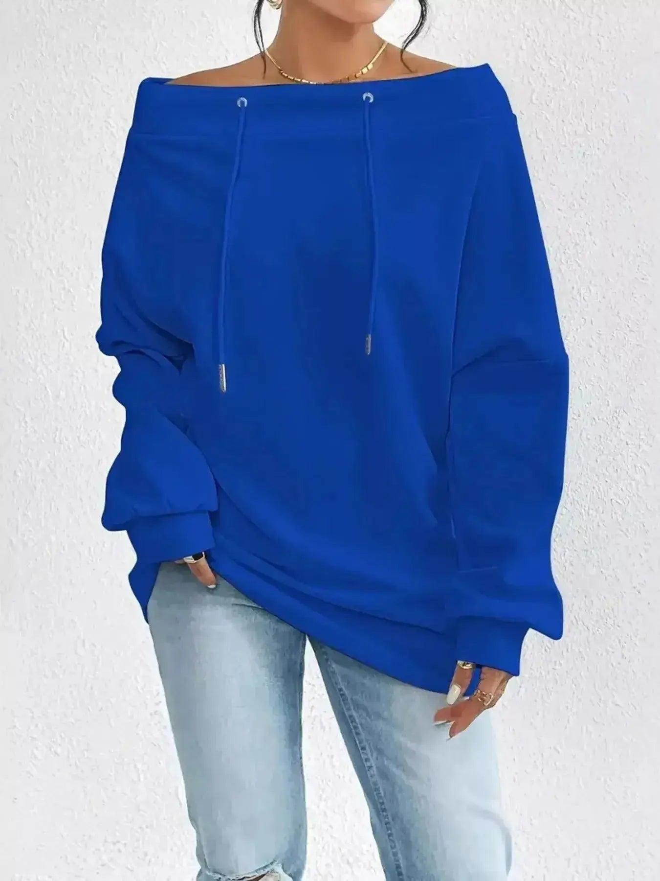 Women's off-shoulder long sleeve sweatshirt with drawstring details from Plush Fashion Hub, stylish and comfortable casual wear