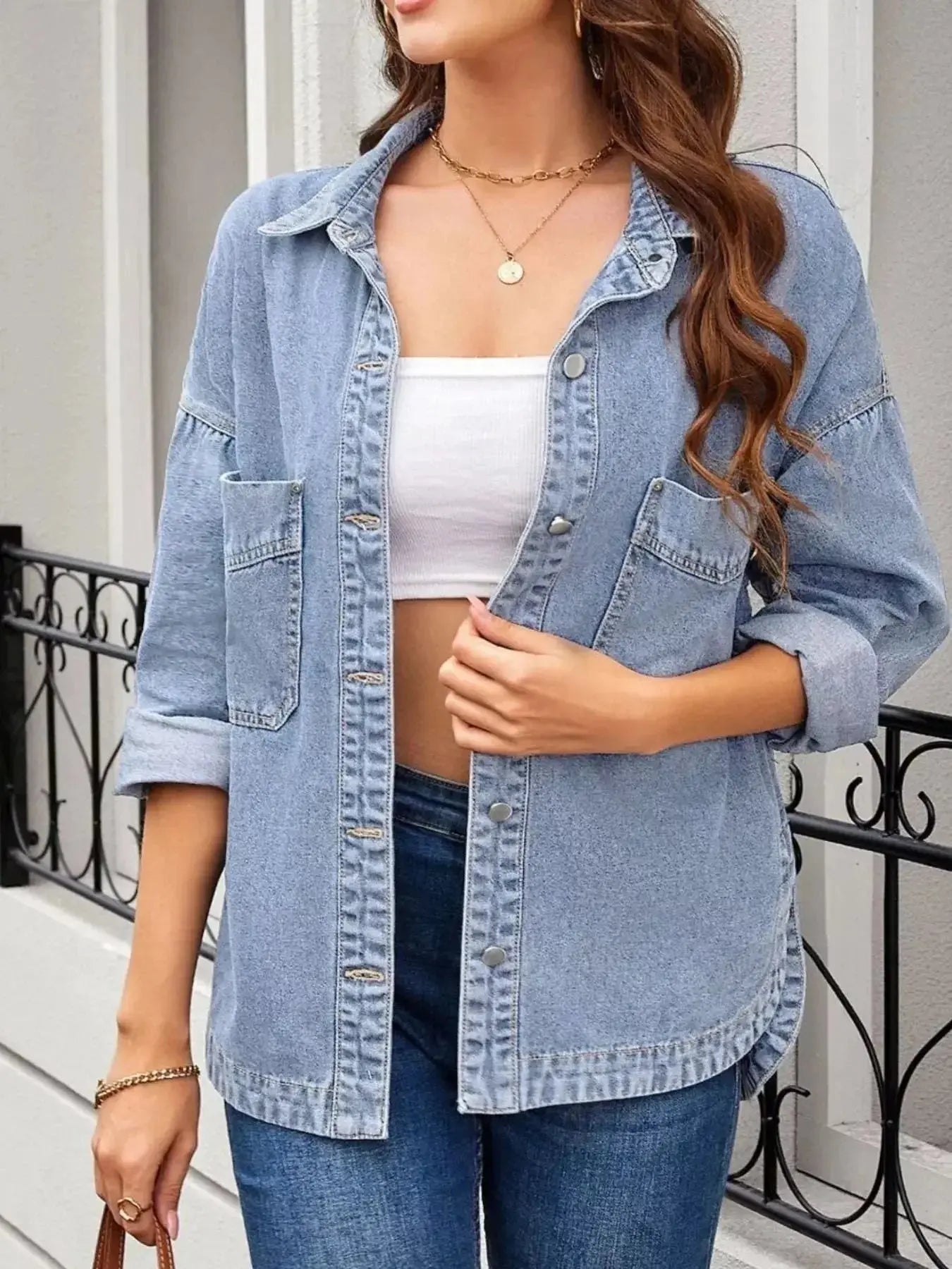 Women’s oversized denim jacket with button-up front, relaxed fit, casual outerwear by Trendsi, shown in classic blue denim.