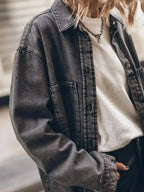 Women's oversized denim button-up shirt by Trendsi, relaxed fit, casual chic style, with long sleeves and classic collar.