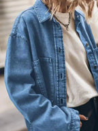 Women’s oversized denim shirt by Trendsi, relaxed fit button-up style, casual chic fashion, shown in a light blue denim fabric.