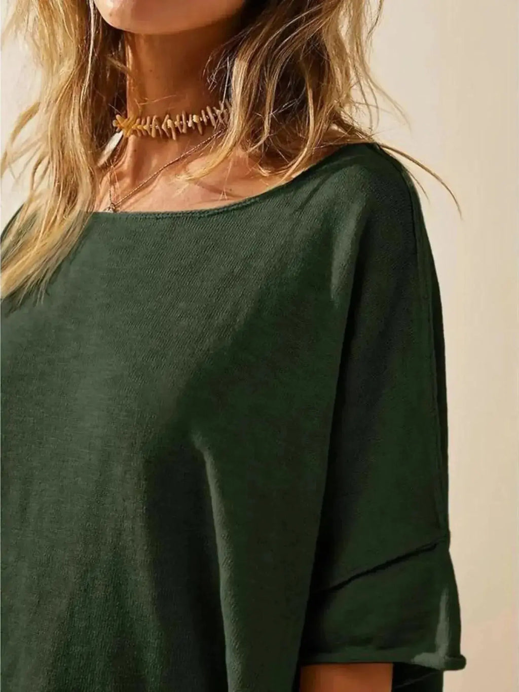 Women's oversized drop-shoulder round neck T-shirt by Trendsi, relaxed casual fit, soft fabric, and stylish loose silhouette.