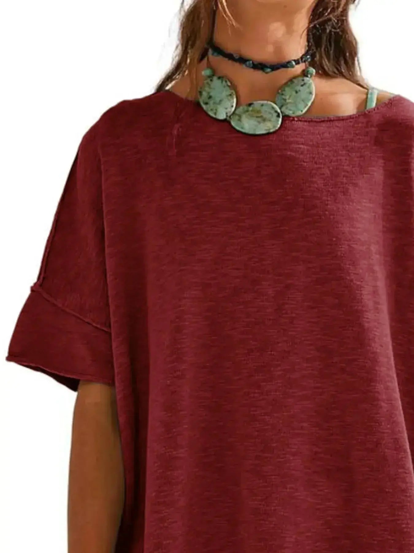 Women’s oversized drop-shoulder round neck T-shirt by Trendsi, relaxed casual fit, soft fabric, and stylish design.