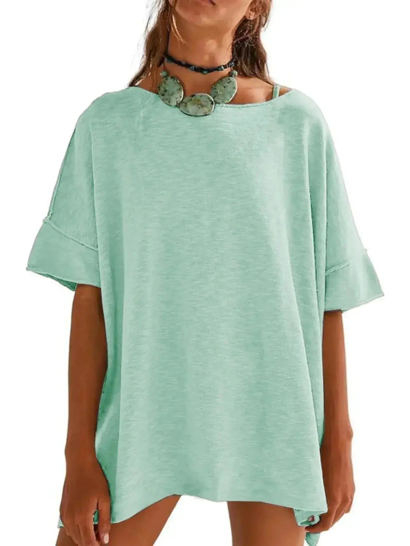 Women’s oversized drop-shoulder round neck T-shirt by Trendsi, relaxed casual fit, soft fabric, and stylish relaxed design.