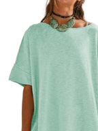 Women’s oversized drop-shoulder round neck T-shirt by Trendsi, relaxed casual fit, soft fabric, and stylish relaxed silhouette.