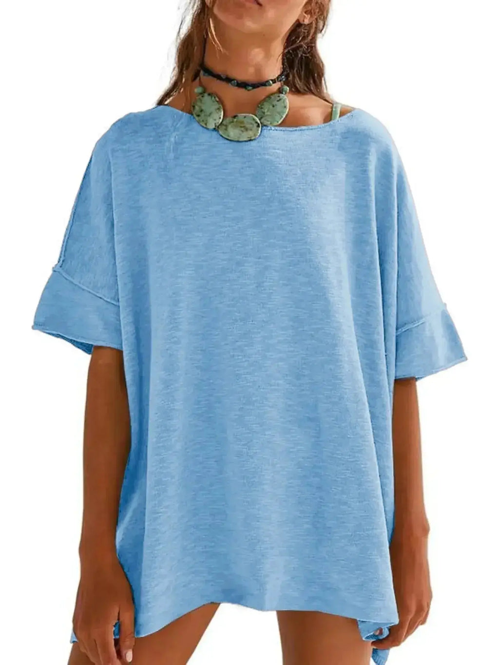Women's oversized drop-shoulder round neck T-shirt by Trendsi, relaxed casual fit, soft fabric, and stylish design.