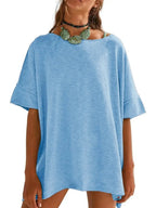 Women's oversized drop-shoulder round neck T-shirt by Trendsi, relaxed casual fit, soft fabric, and stylish design.