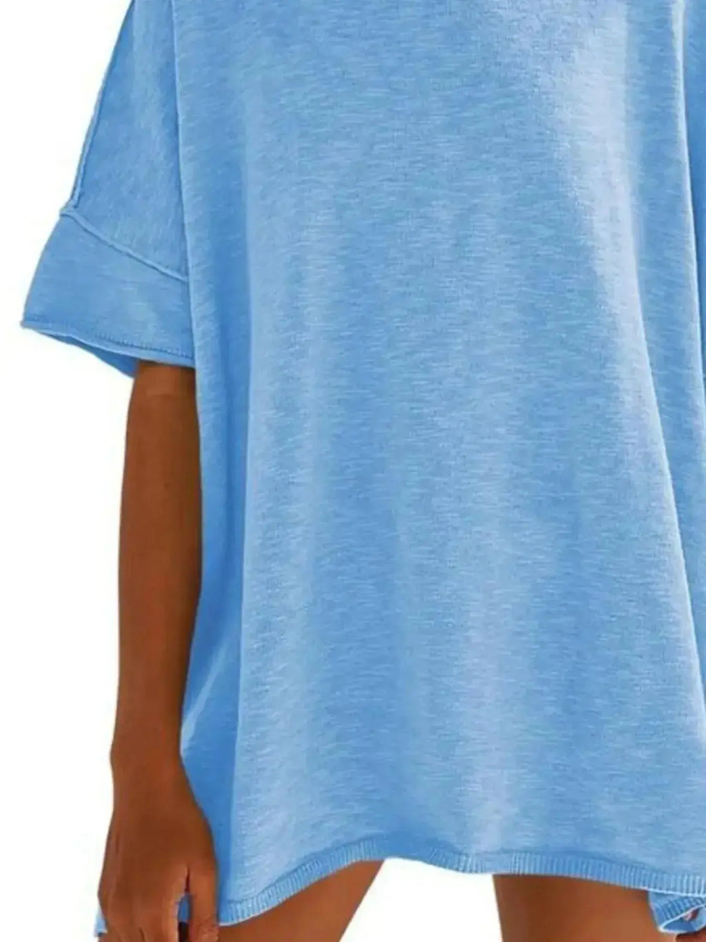 Women’s oversized drop-shoulder round neck T-shirt by Trendsi, relaxed casual fit, soft fabric, worn as a comfortable everyday tee.