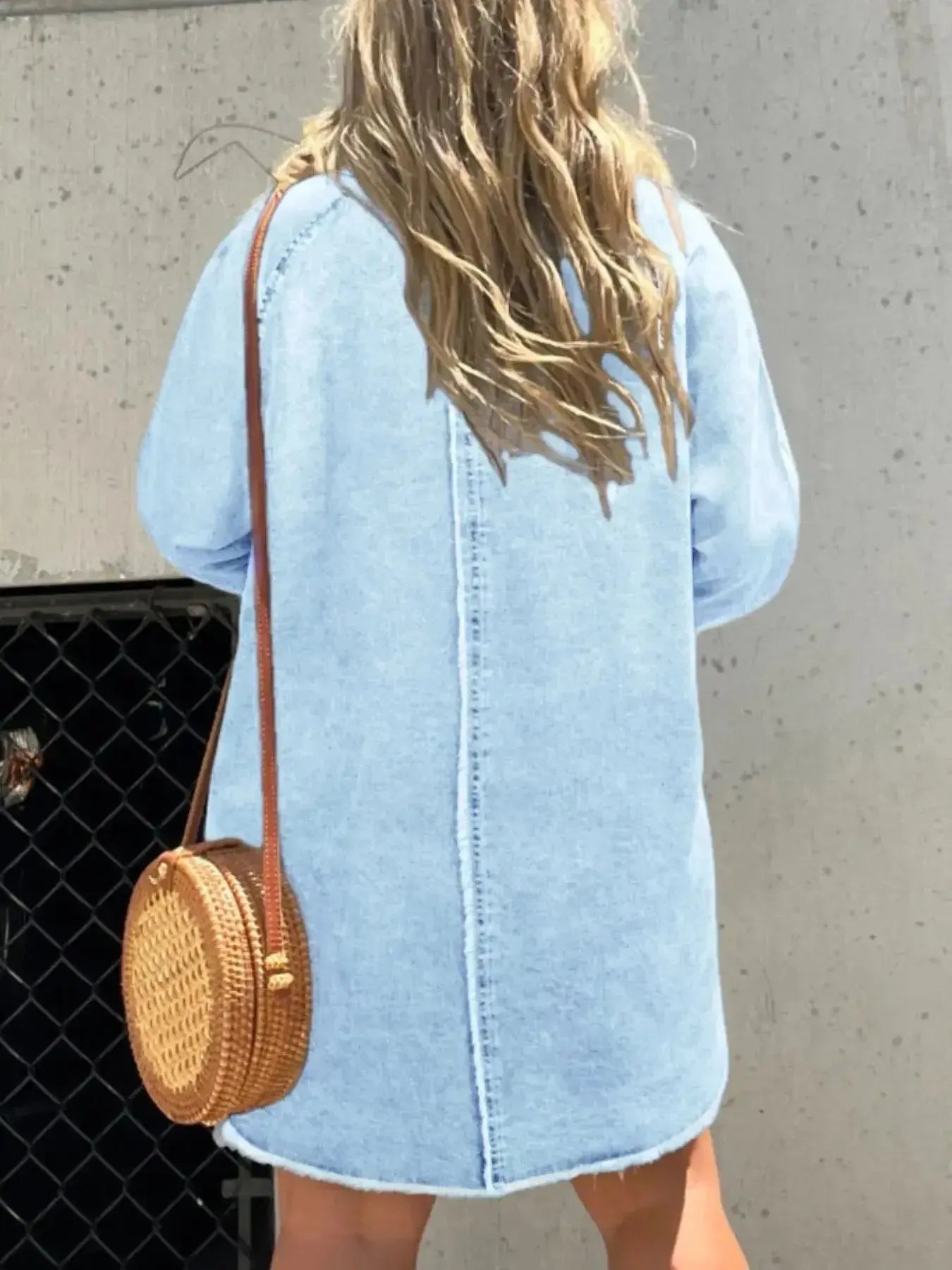 Women's oversized long sleeve denim shirt dress with pockets, casual style by Trendsi, featuring a relaxed fit and button-front design.
