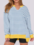 Women’s oversized notched neck sweatshirt with contrast stitching, casual sweater from Trendsi, shown with relaxed fit and stylish details.