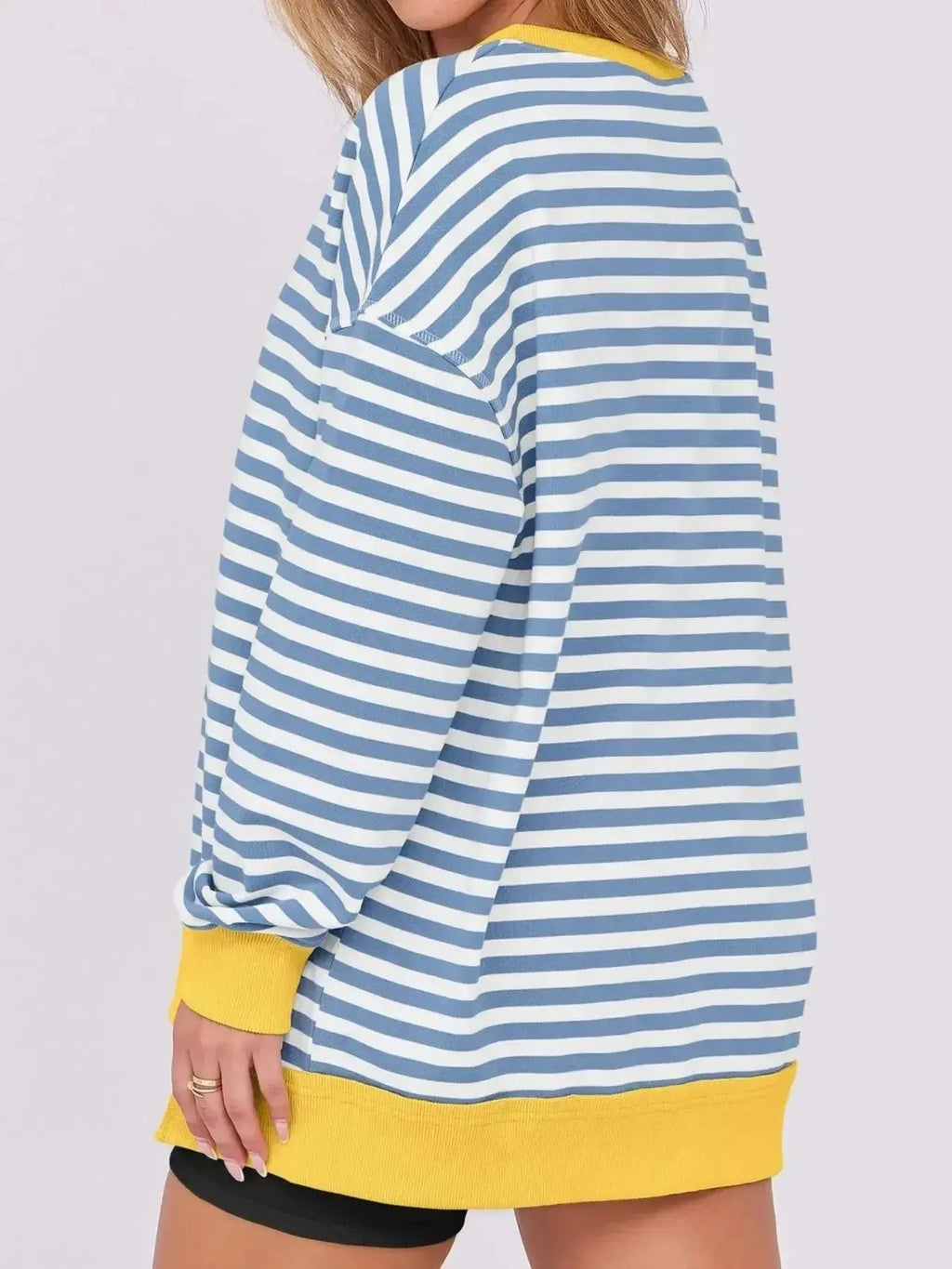 Women's oversized notched neck sweatshirt with contrast stitching, casual sweater by Trendsi, featuring a relaxed fit and stylish design.