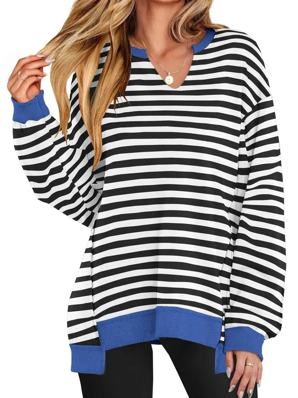 Women's oversized notched neck sweatshirt with contrast stitching, stylish and comfortable sweater by Trendsi worn by a model.