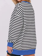 Women’s oversized notched neck sweatshirt with contrast stitching, casual sweater by Trendsi, shown on a model.
