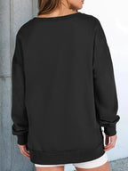 Women's oversized notched neck sweatshirt from Trendsi with contrast stitching, featuring a relaxed fit and stylish design.